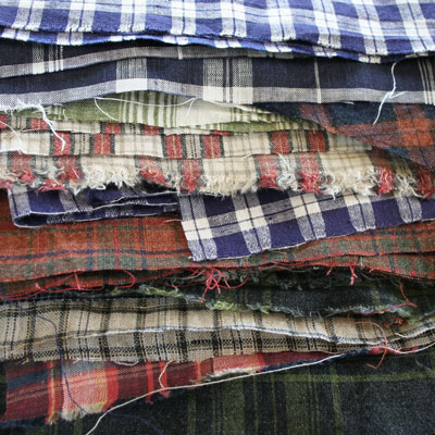 Heap of checked Irish linens newly arrived from Emblem Weavers